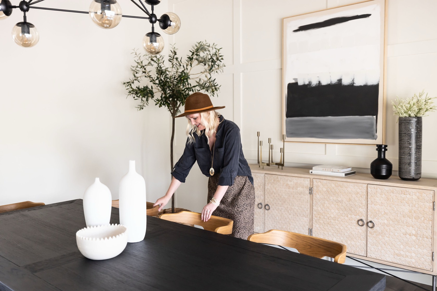 Interior designer styling an elevated modern dining room in an Arizona home by Treasure in the Detail